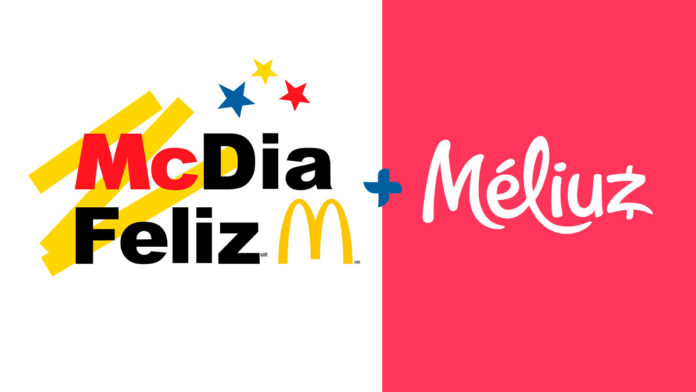A foto apresenta o logo do McDia Feliz e do Méliuz separados por um sinal de mais, em um fundo branco e rosa.