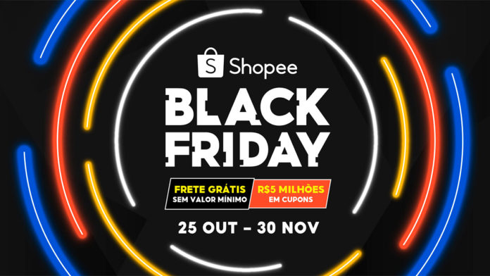 A foto apresenta o banner da campanha Black Friday Shopee, com um fundo preto e luzes coloridas fazendo um círculo em volta do logo da campanha com suas informações.