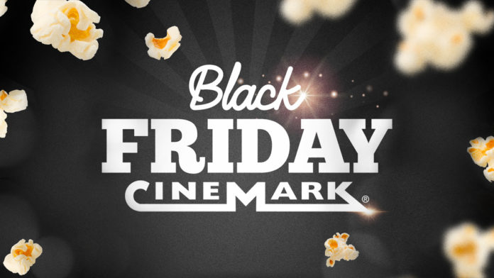 A foto apresenta o logo da Black Friday da Cinemark junto com um fundo preto e várias pipocas ao redor.