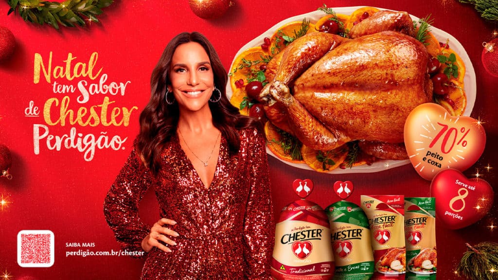 A foto apresenta o banner da campanha de Natal da Perdigao, com a Ivete Sangalo ao lado da linha Chester e da frase "Natal tem sabor de Chester Perdigão".