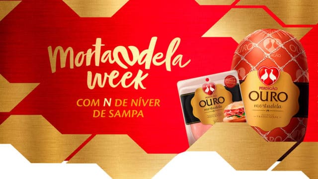 A foto apresenta o logo da Mortandela Week, com a frase "com N de niver de Sampa" e ao lado da Mortadela Ouro Perdigão.