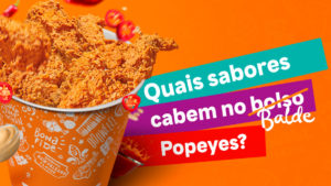 A foto apresenta um balde do Popeyes.