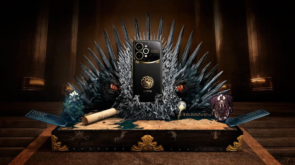 Smartphone Realme 15 Pro Game of Thrones Limited Edition, posicionado em um trono de ferro com detalhes de dragões e acessórios temáticos, sobre uma mesa decorada com uma réplica de Westeros e itens colecionáveis.