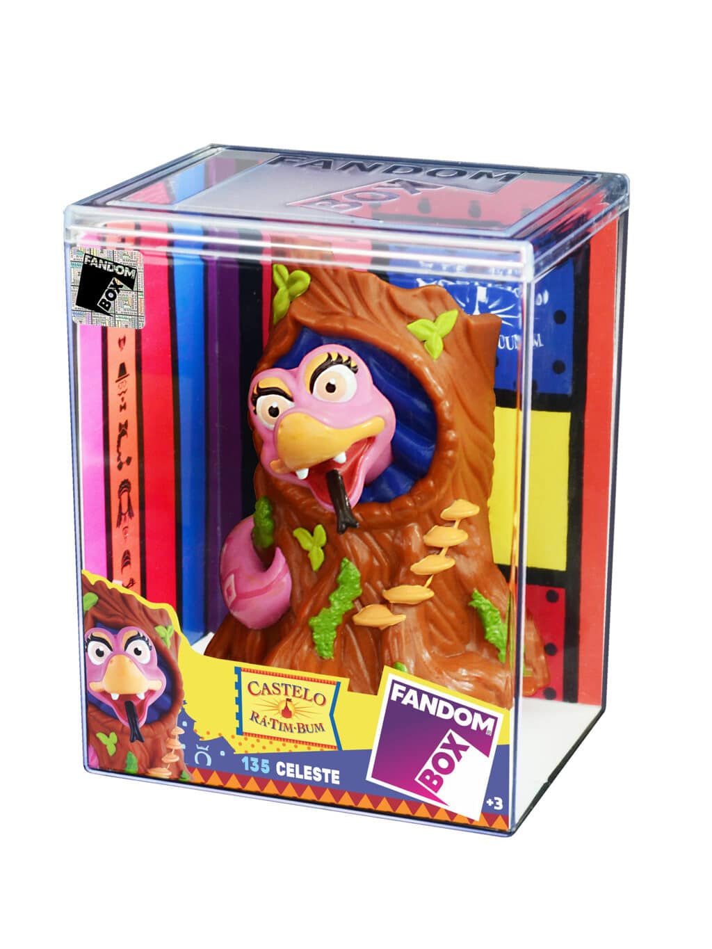 Figura colecionável da personagem Celeste, do programa Castelo Rá-Tim-Bum, em uma embalagem da Fandom Box. A figura é inserida em um tronco de árvore e apresenta detalhes coloridos.
