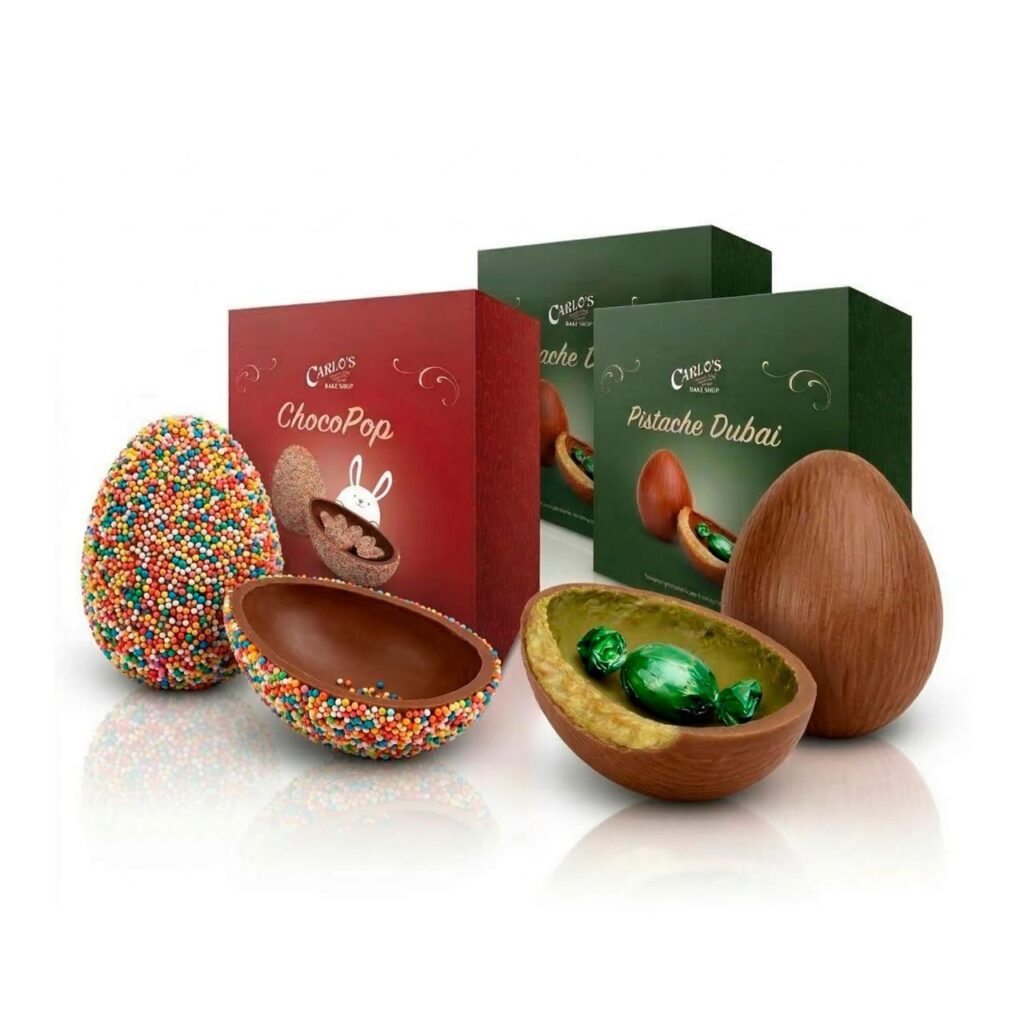Decorative chocolate eggs and gift boxes, including ChocoPop and Pistache Dubai selections, showcasing colorful sprinkles and green candy inside.