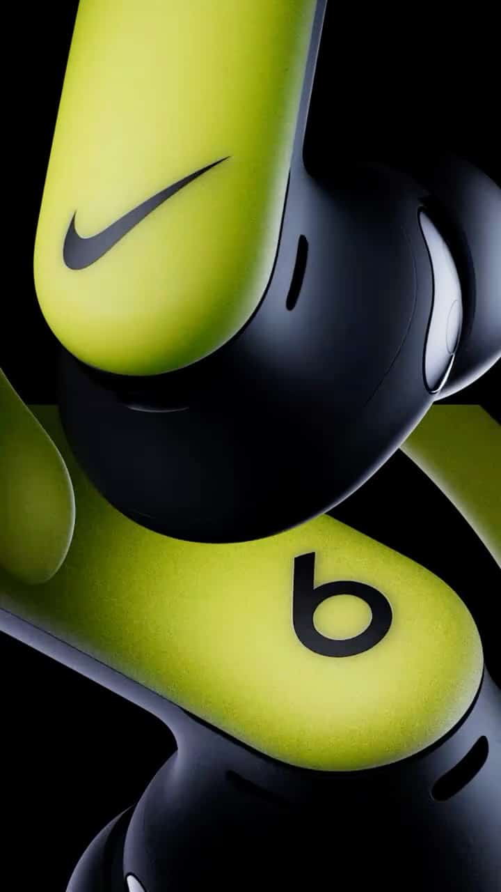 Close-up of Nike-branded wireless earbuds featuring a vibrant green and black design.