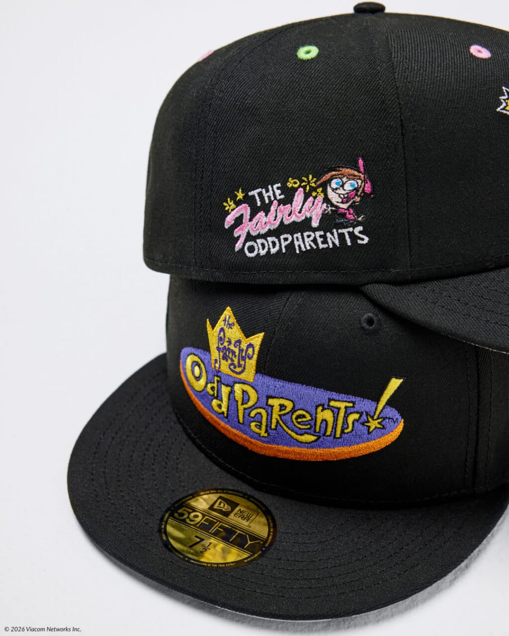 A black snapback hat featuring embroidered logos from 'The Fairly OddParents' and 'The OddParents', showcasing colorful designs.