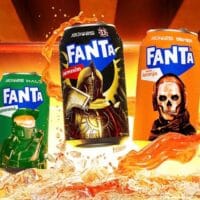 Banner com latas da Fanta colecionáveis inspiradas em jogos, com lata “Fanta” no centro e personagens ao fundo.