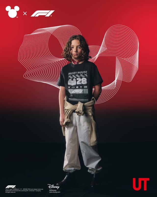 A child wearing a black Mickey Mouse graphic t-shirt and light-colored pants stands against a red background with abstract white lines. The image features branding for Disney and Formula 1.