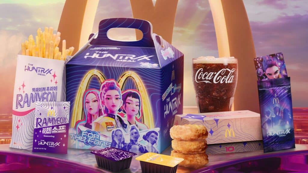 A promotional meal box from McDonald's featuring the Huntrax meal, including fries, a drink, chicken nuggets, and unique packaging with colorful graphics and characters.