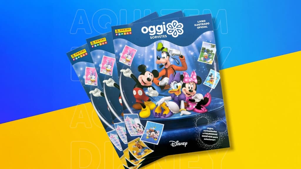 Álbum de figurinhas Oggi Panini Disney Álbum de figurinhas Oggi Panini Disney com personagens da Disney e jogos exclusivos, em fundo azul e amarelo.