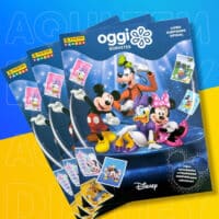 Álbum de figurinhas Oggi Panini Disney com personagens da Disney e jogos exclusivos, em fundo azul e amarelo.