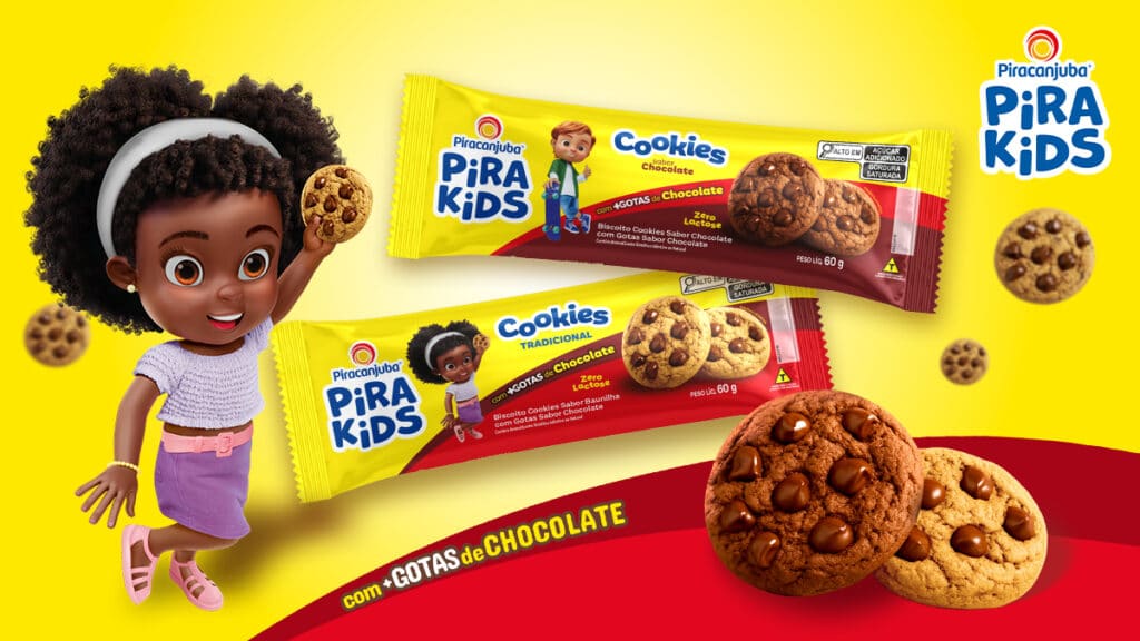 Pirakids Cookies zero lactose com gotas de chocolate Embalagens Pirakids Cookies zero lactose com gotas de chocolate e personagem infantil em fundo amarelo