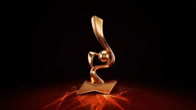 Trofíu dourado em formato de drible sobre base com faísca, remetendo ao prêmio The Dribbler da Budweiser na Copa do Mundo 2026.