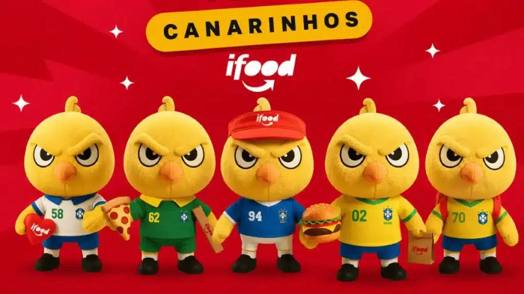 Bonecos canarinho Ifood em fundo vermelho, com cinco personagens de uniforme e escudo, em promoção da Copa 2026.