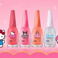 Esmaltes da Colorama com personagens da Hello Kitty and Friends em fundo rosa com corações e estrelas.