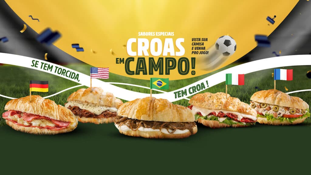 Banner da Croasonho com croissants salgados inspirados na Copa do Mundo, com texto “CROAS EM CAMPO!” e bandeiras.