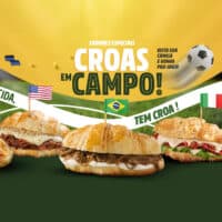Banner da Croasonho com croissants salgados inspirados na Copa do Mundo, com texto “CROAS EM CAMPO!” e bandeiras.