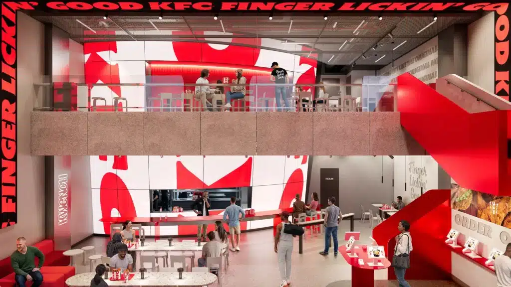 Render de loja KFC reformulada, com layout moderno, balcões e destaque vermelho e branco no salão