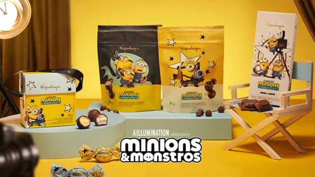 Embalagens de chocolates Kopenhagen Minions & Monstros, com personagens dos Minions e tabletes e drágeas na mesa.