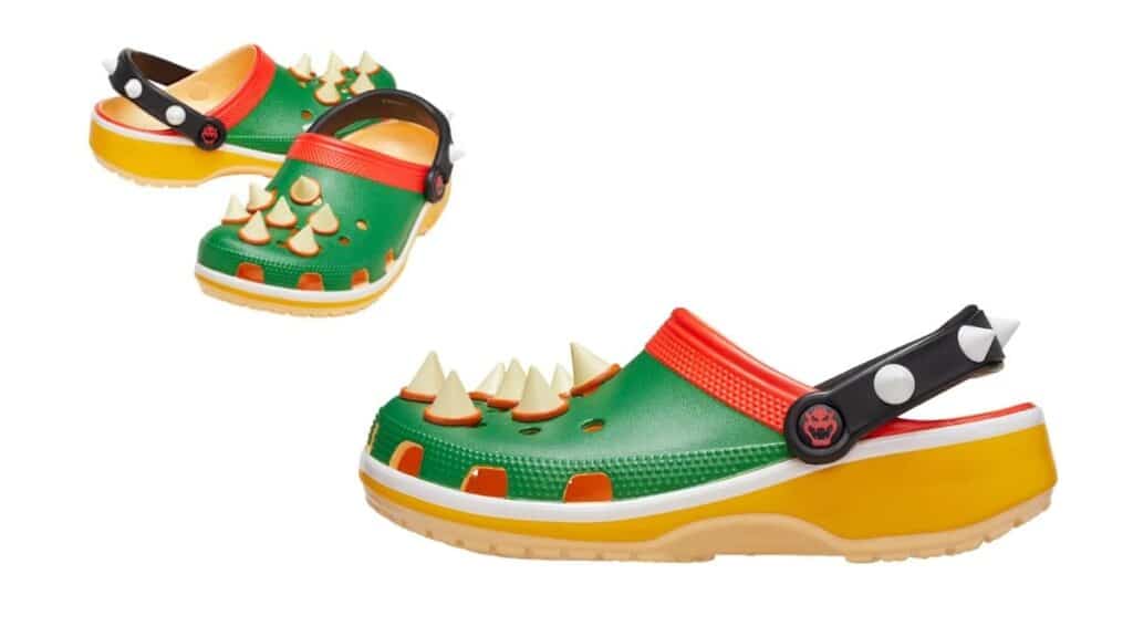 Par de Crocs Classic Clogs com tema de Super Mario Bros, na cor verde, com detalhes de cogumelos e paleta laranja.