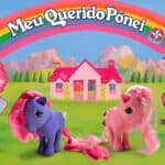 Personagens da linha Meu Querido Pônei da Estrela, com pôneis e arco-íris ao fundo em cenário colorido