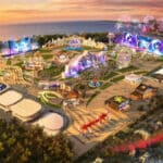 Vista aérea do Rock in Rio 2026 com estandes e áreas temáticas iluminadas no pôr do sol na Cidade do Rock.