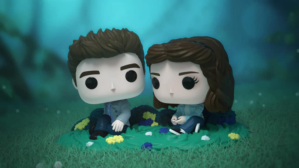 Funko Pop! de Bella e Edward sentados no prado, inspirados em Crepúsculo, coleção temática.