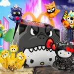 Brinquedos do McLanche Feliz com Hello Kitty em tema Godzilla, com personagens estilizados na cena