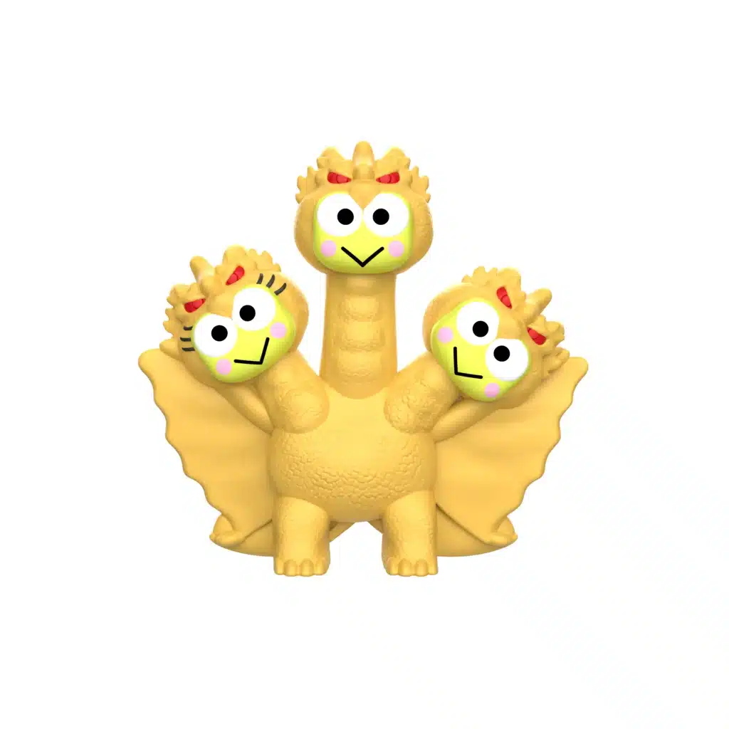 Brinquedos do McLanche Feliz com três figuras estilo Godzilla com rosto de personagem, em cor amarela