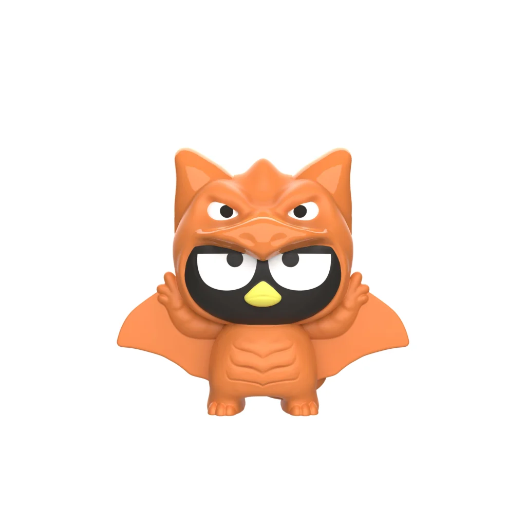 Brinquedo do McLanche Feliz com personagem estilo Godzilla em formato de gato laranja, olhando para a frente.