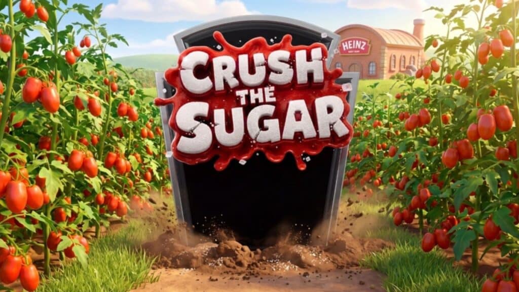 Heinz “Crush the Sugar”: game de esmagar ketchup no campo de tomates Jogo “Crush the Sugar” da Heinz, com ketchup escuro sendo esmagado em cena entre pés de tomate.
