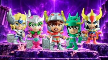 Fandom Box: figuras colecionáveis de Os Cavaleiros do Zodíaco Cinco figuras estilizadas de Os Cavaleiros do Zodíaco em cenário roxo, com armaduras e caixas colecionáveis