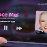 Tela de playlist com a música “Doce Mel”, destacando a campanha da Nissan com referência à Xuxa