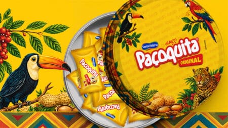 Lata colecionável Paçoquita Original edição limitada Lata colecionável de Paçoquita Original com ilustrações de pássaros e animais sobre fundo amarelo, com pacotes ao redor.