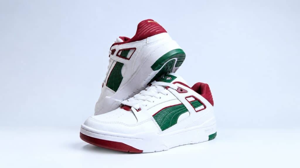 Tênis PUMA Slipstream branco com detalhes verdes e vermelhos, edição exclusiva para a torcida do Fluminense.
